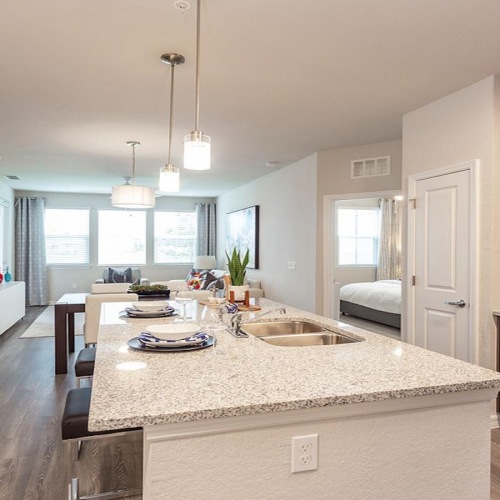 a kitchen with a marble island