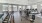 a room with exercise equipment and chairs