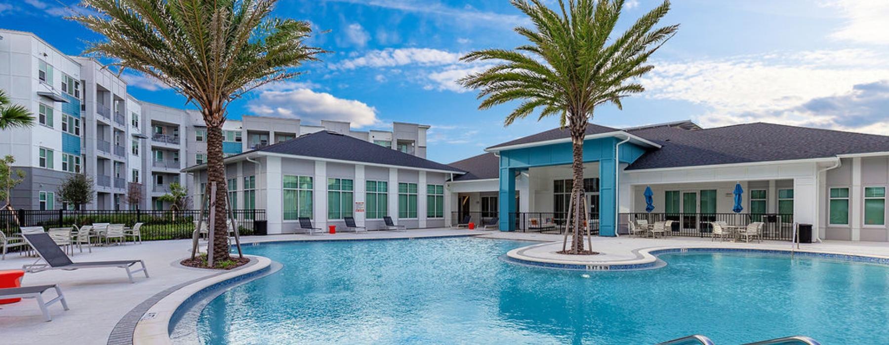a swimming pool in front of a building