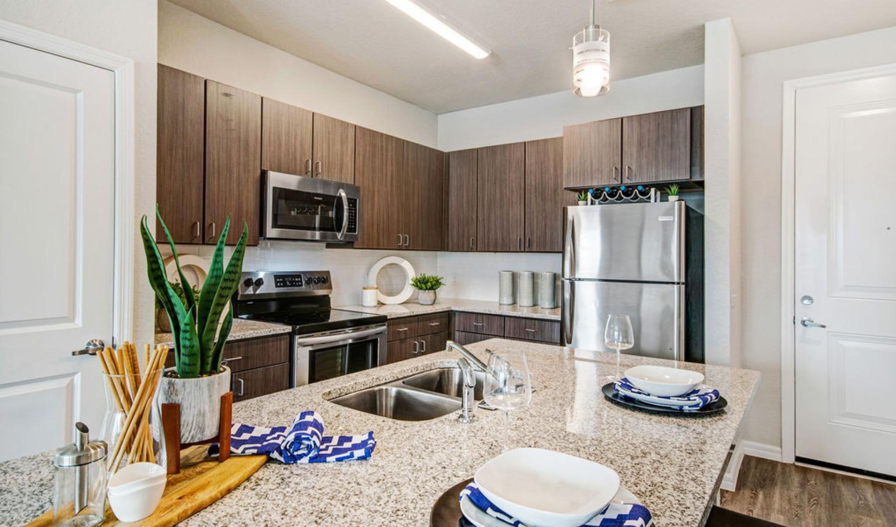 a kitchen with a marble countertop