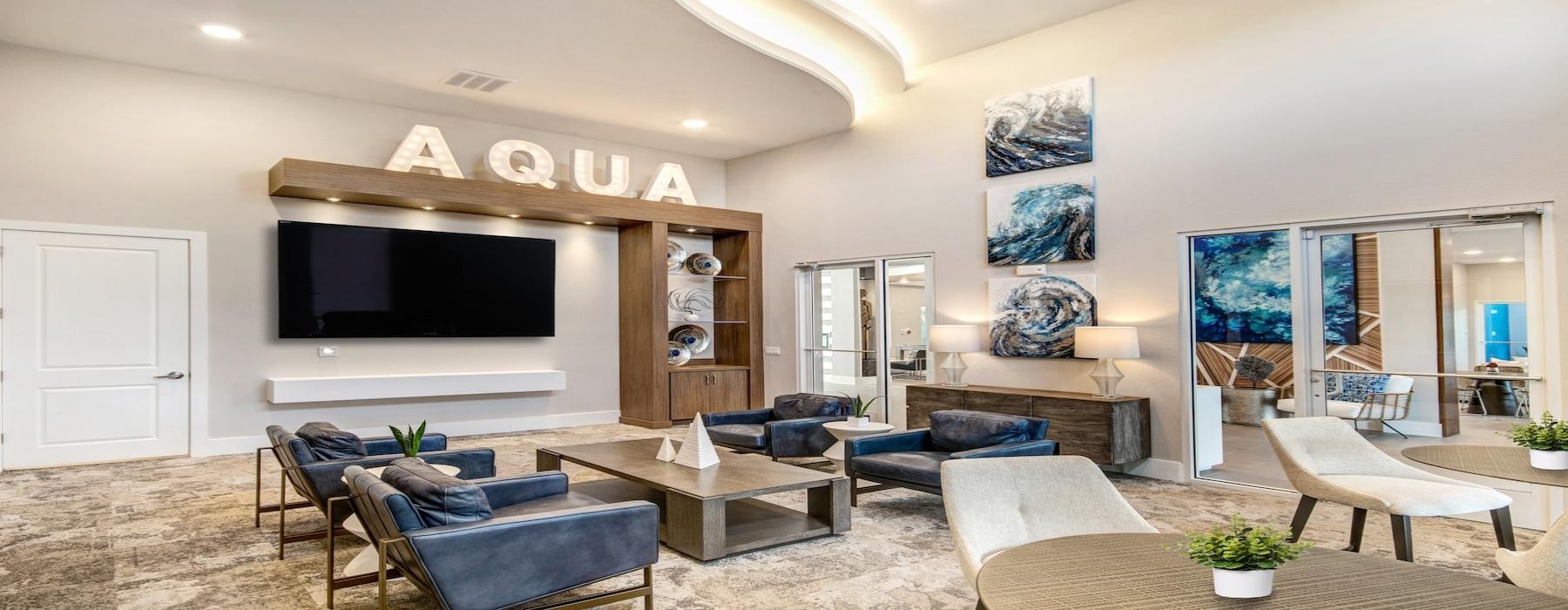 a living room with a tv and couches