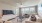 a living room with a tv and couches